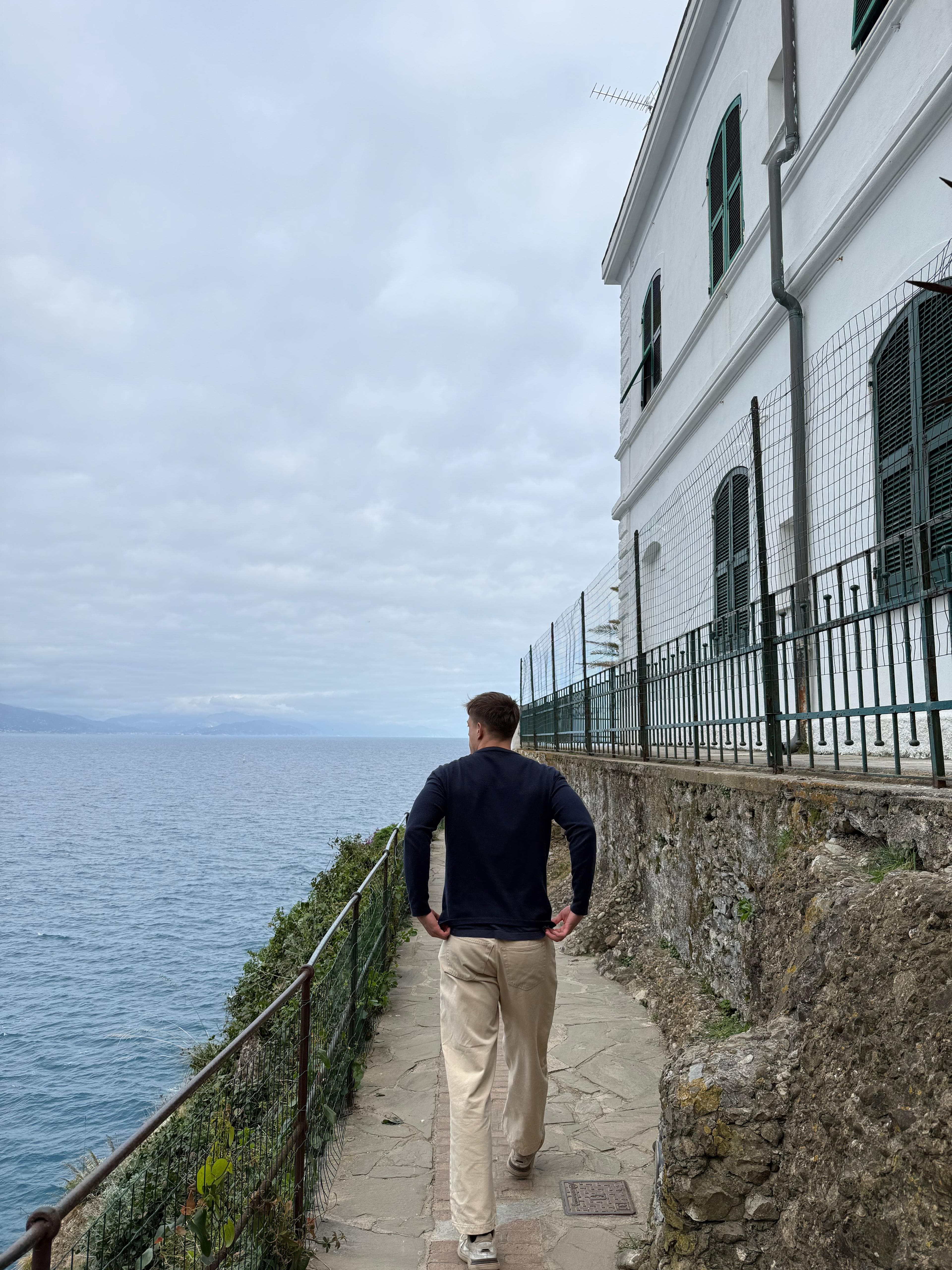 Giuseppe walking by the sea
